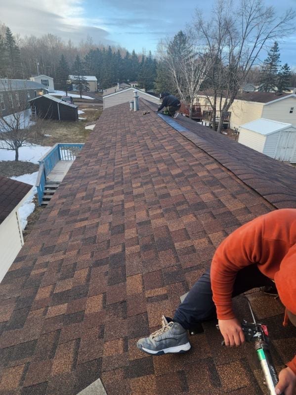 New brown architectural shingles on the finished roof