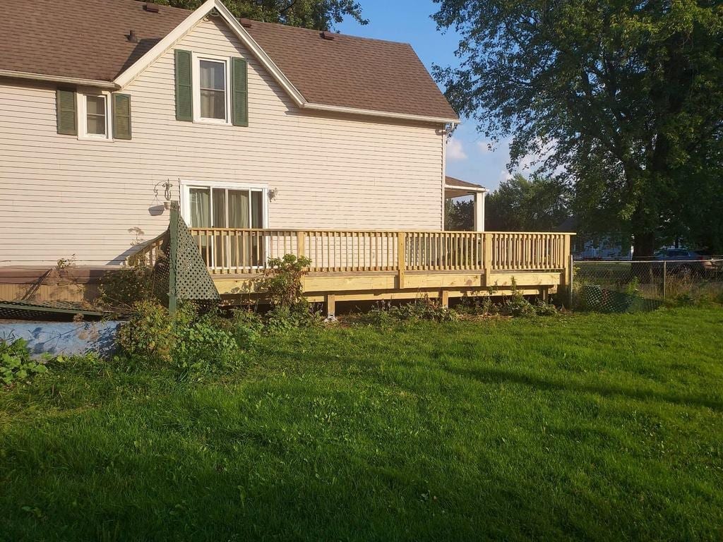 New deck and railing seen from the side yard